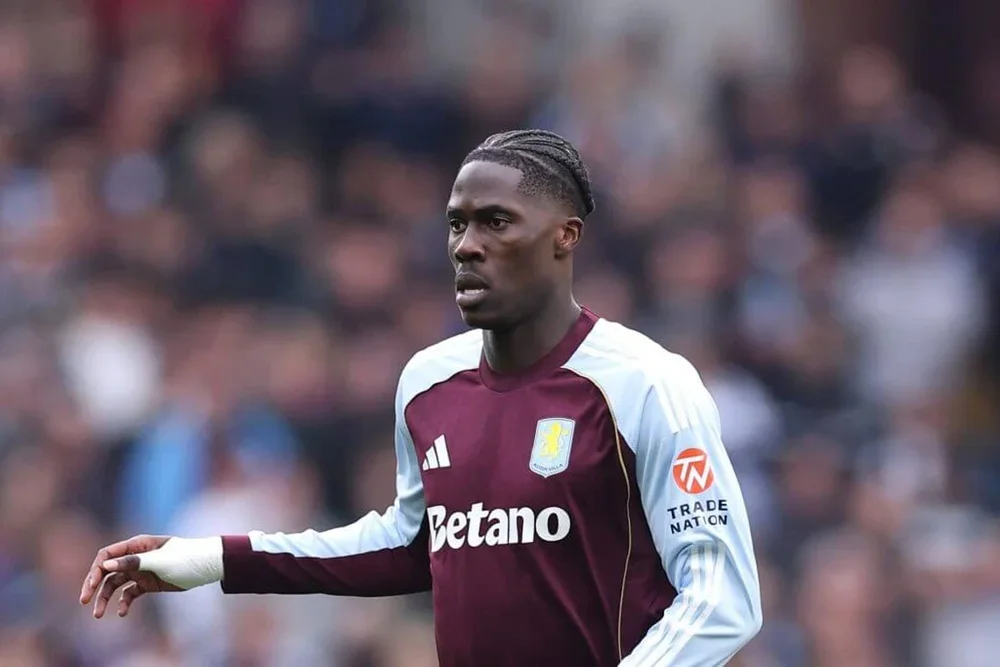 Amadou Onana, wearing Aston Villa's claret and blue home shirt, in action